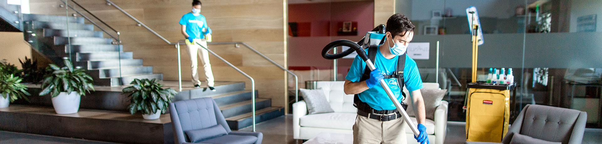 two ServiceMaster Clean employees cleaning concrete floor